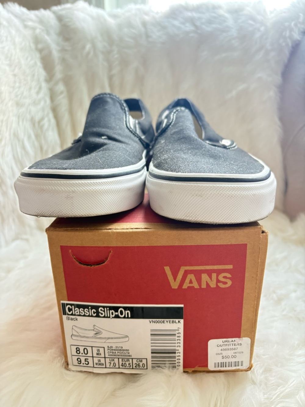 Vans Black and White Classic Slip-On Sneakers